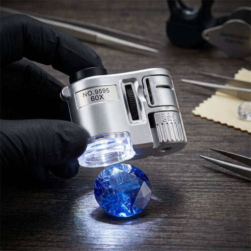 60X handheld LED UV magnifying loupe inspecting fine detail