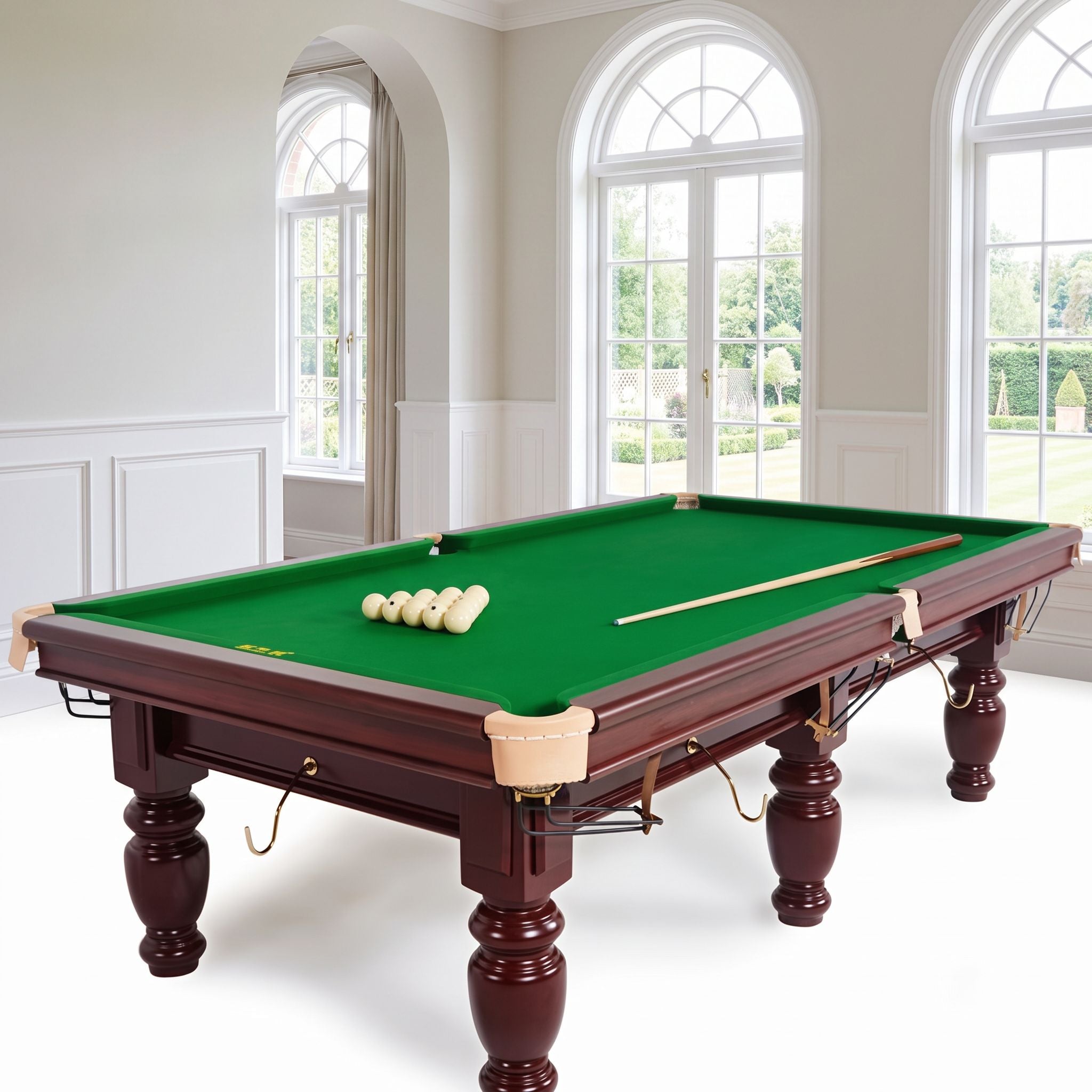Billiard table cloth installed on a pool table in a bright games room