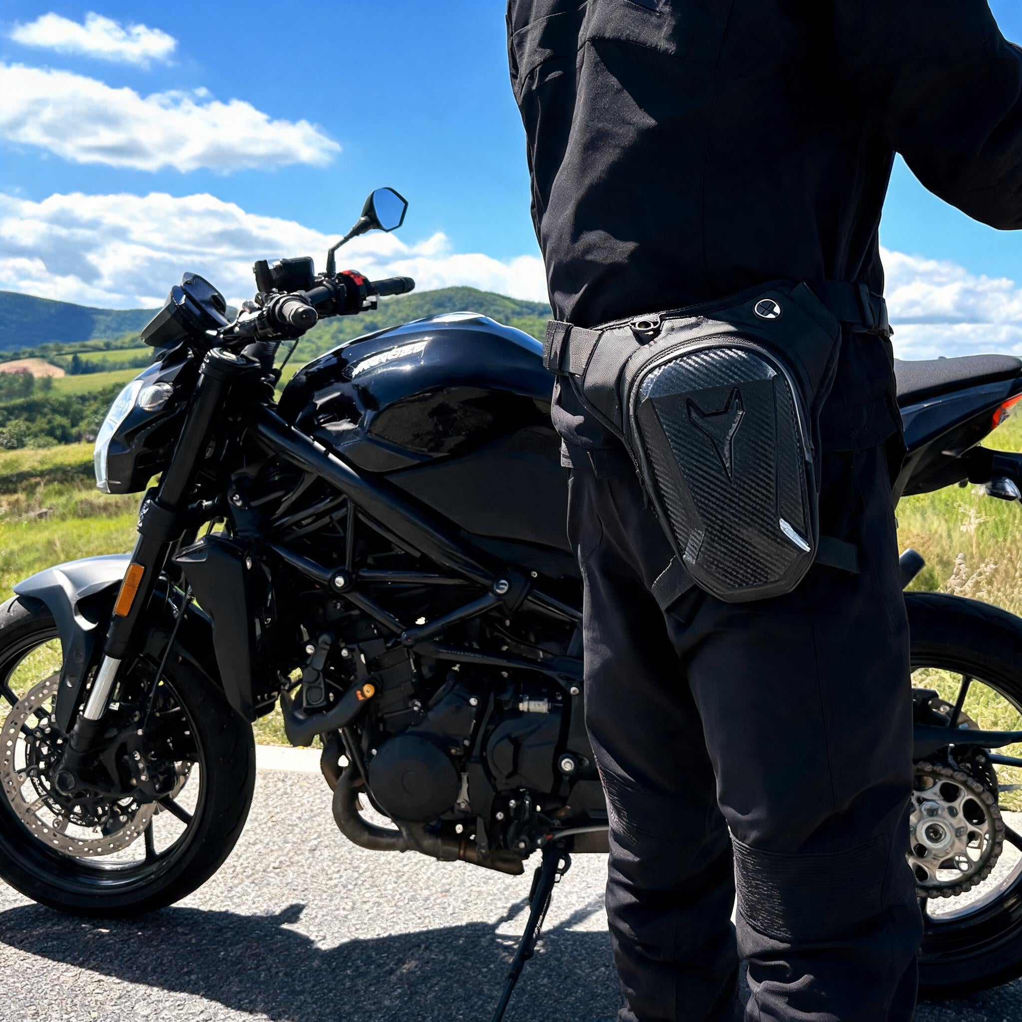Motorcycle leg bag strapped to a rider's thigh in daylight