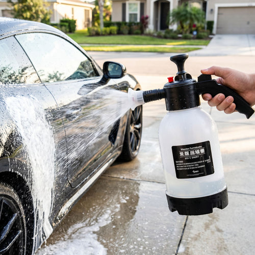 2L pressurized foam car wash spray pot in use on a driveway